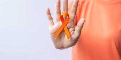 Orange Ribbon for Leukemia, Kidney cancer day, world Multiple Sclerosis, CRPS, Self Injury Awareness month. Healthcare and word cancer day concept